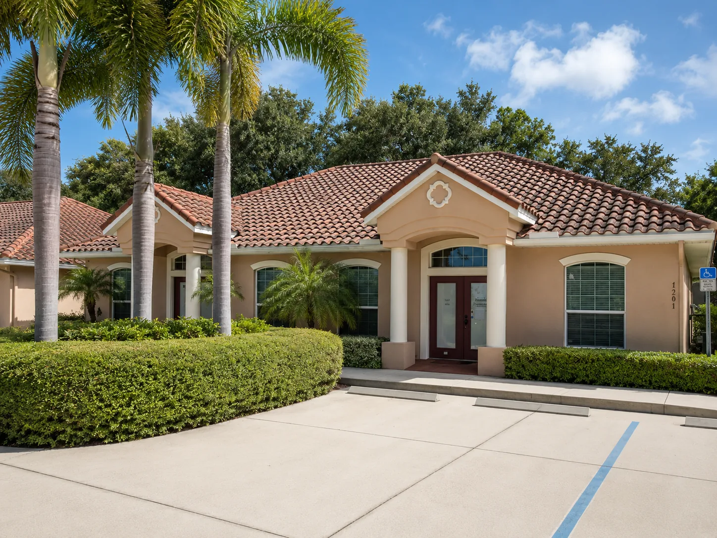 The palm-lined exterior of our Rockledge office